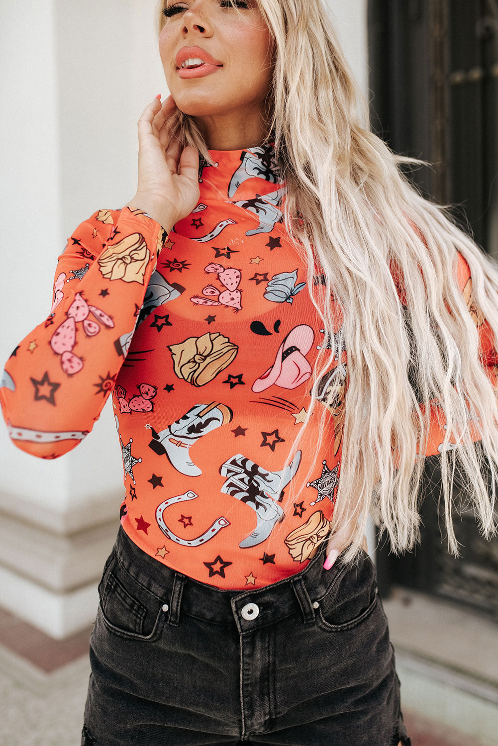 Orange Rodeo Bound Cowgirl Boot Pattern Long Sleeve Bodysuit